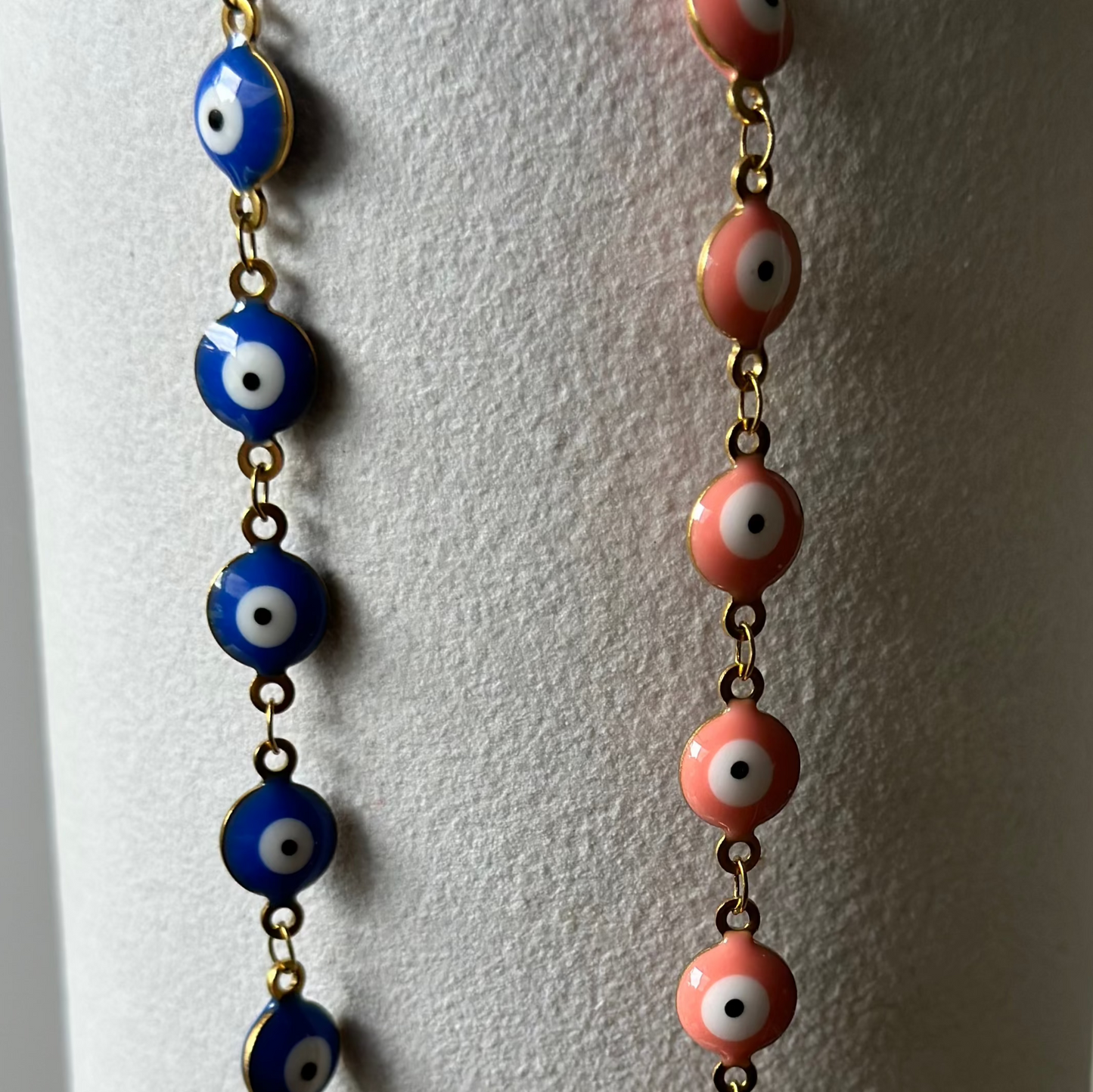 blue and pink evil eye