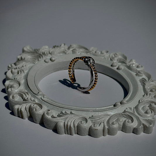 gold and silver knot ring