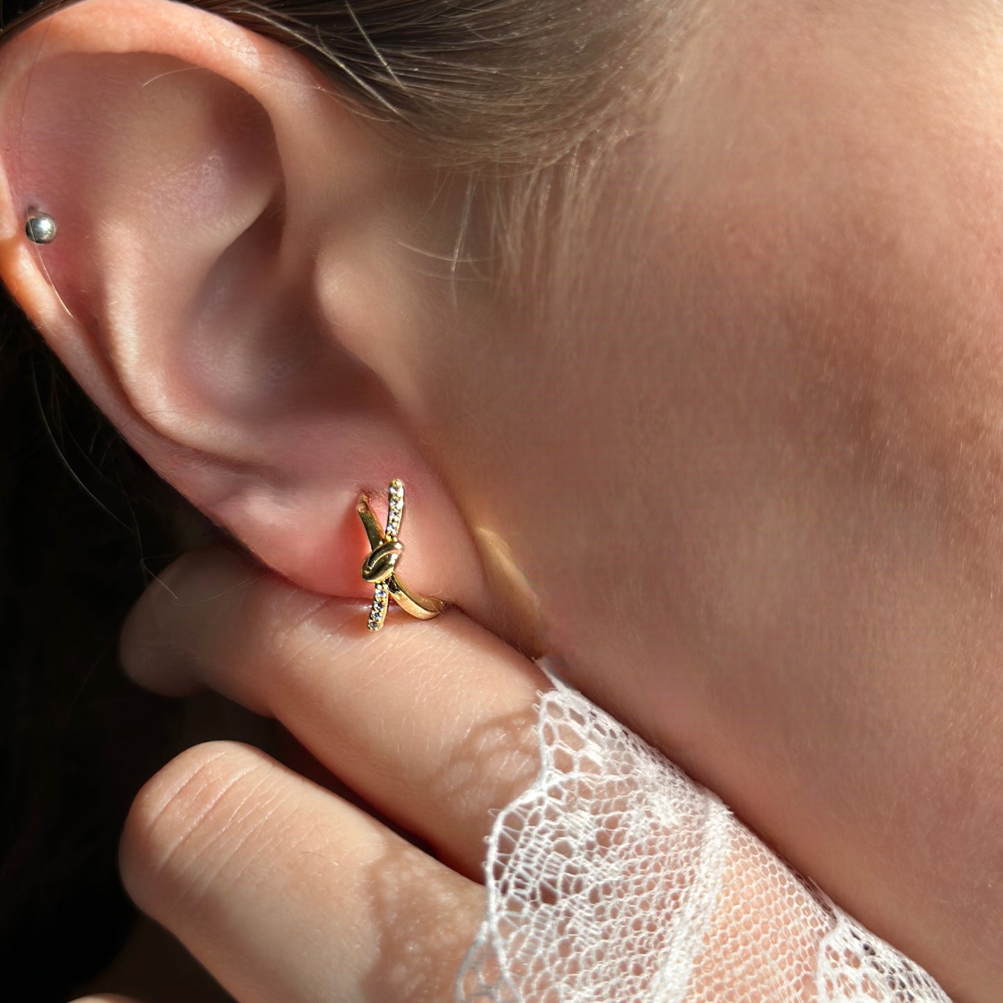 gold earrings bow design
