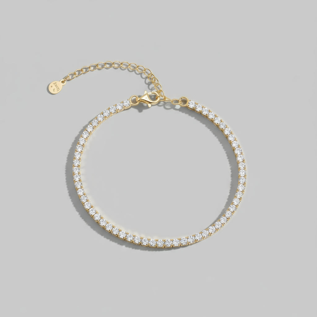 Gold tennis bracelet with zirconia stones, material details