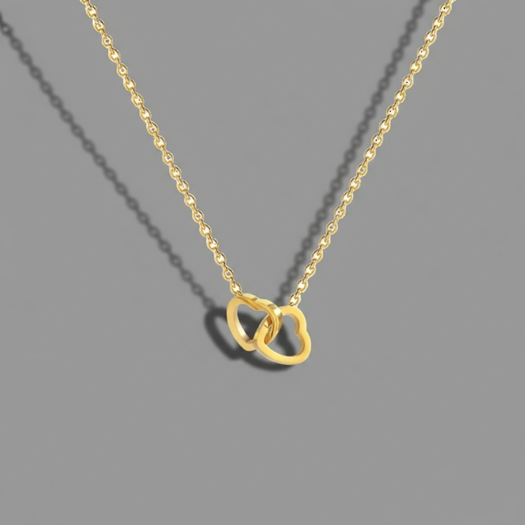 Gold love heart stainless steel necklace with two hearts intertwining with eachother 