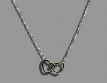silver necklace made with stainless steel with two hearts intertwined 
