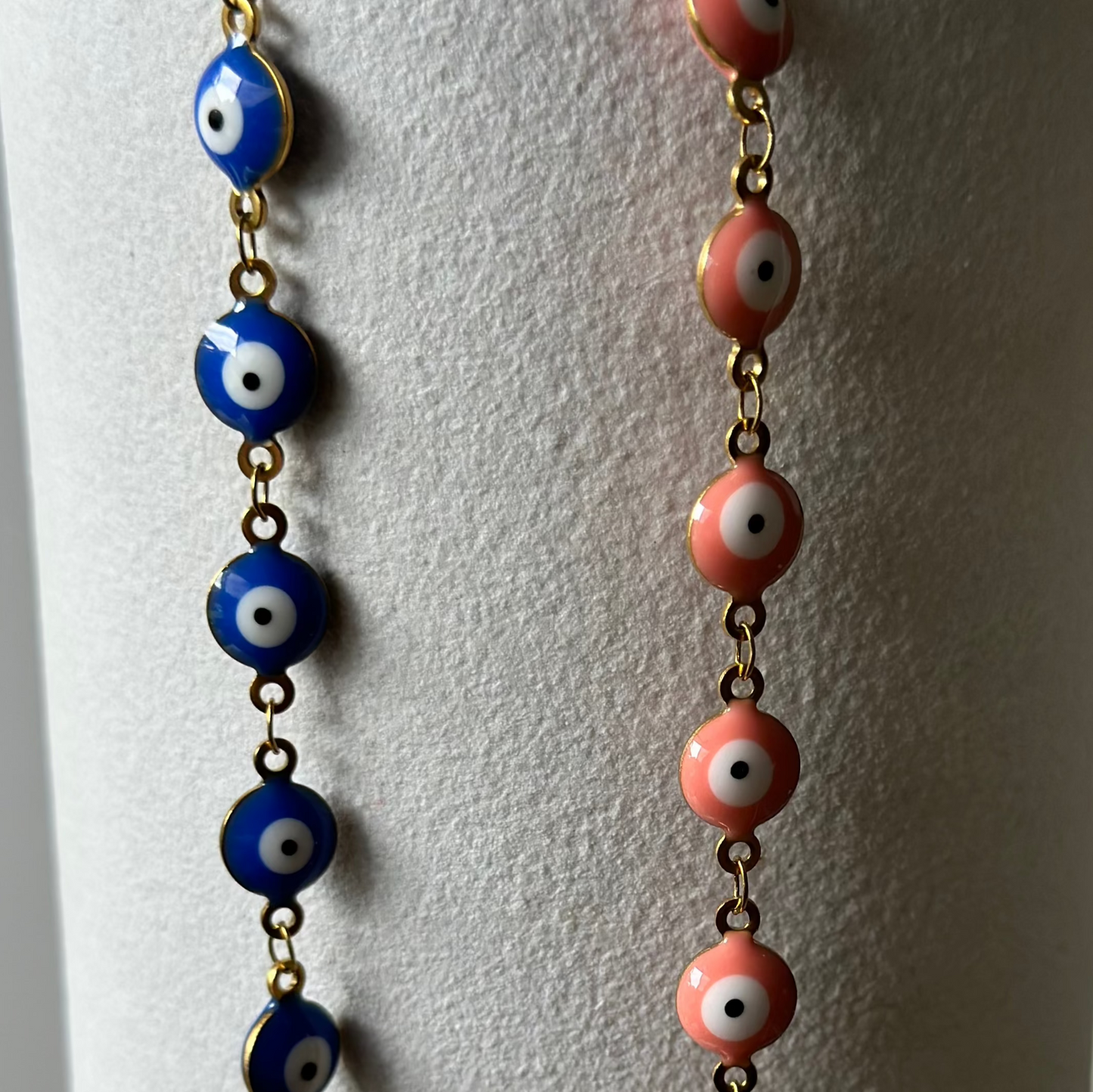 blue and pink evil eye 