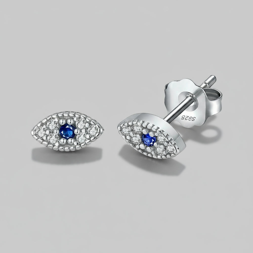 Silver earrings with blue gemstones on a white background, featuring 'Real Sterling Silver'.