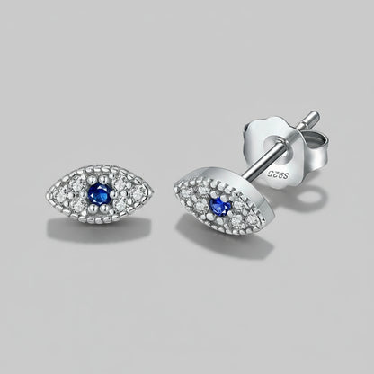 Silver earrings with blue gemstones on a white background, featuring 'Real Sterling Silver'.