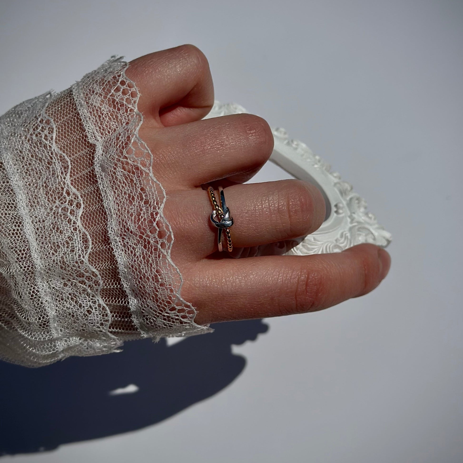 gold and silver knot ring resizable on finger 