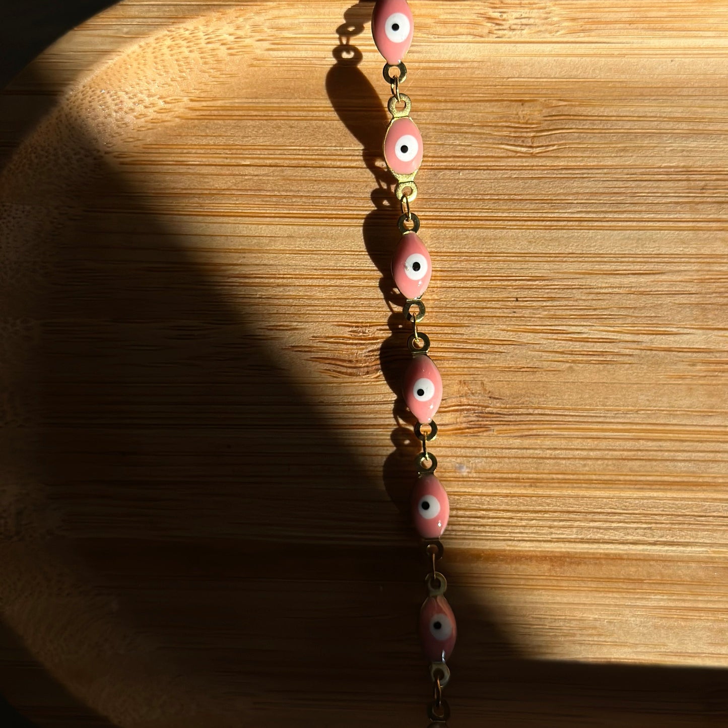 pink oval evil eye bracelet